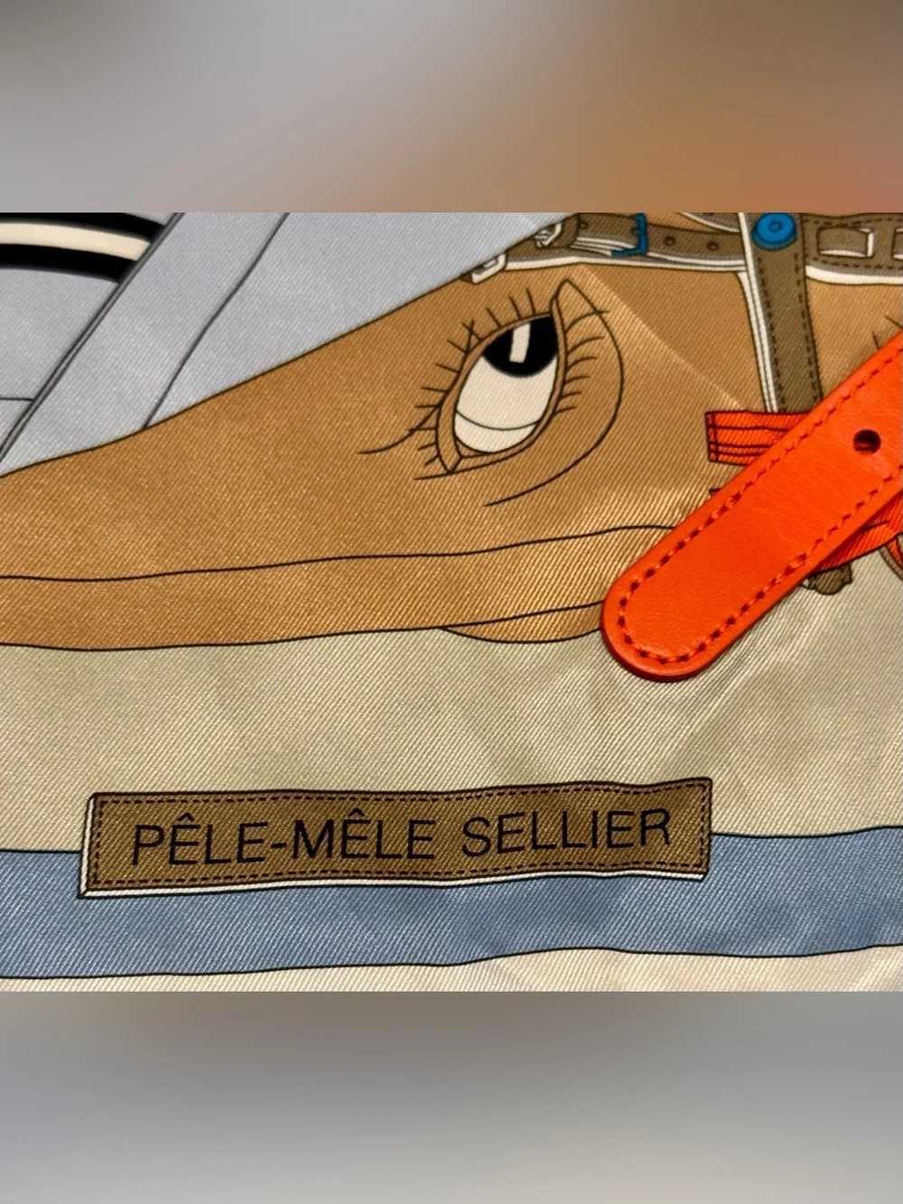 Hermes Pele Mele Silk Scarf with leather buckle.